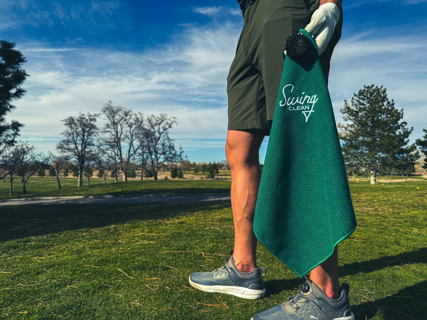 Golf towel held by golfer on course