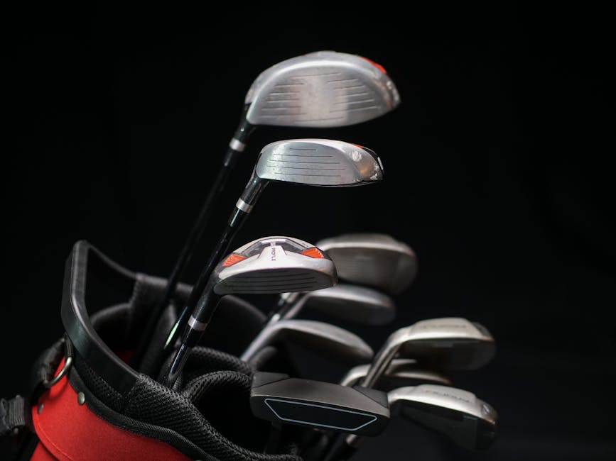 Golf clubs in a bag on black background