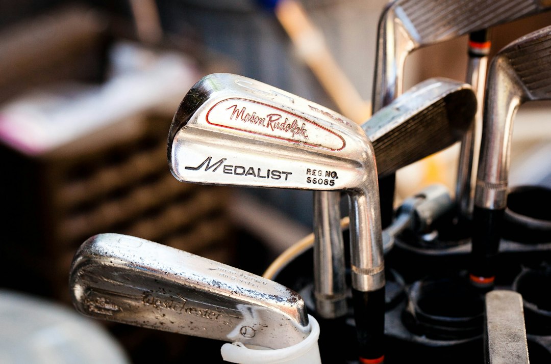 old metal golf clubs in a bag