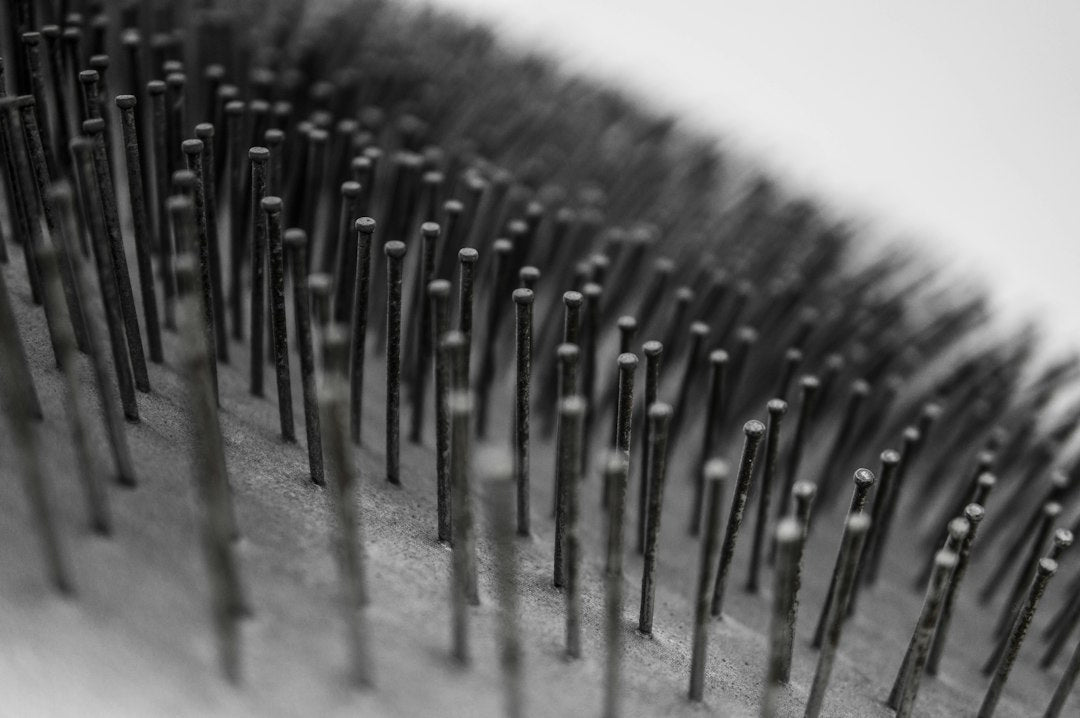 Macro view of metallic hairbrush spikes