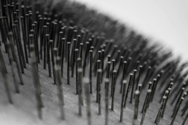 Macro view of metallic hairbrush spikes
