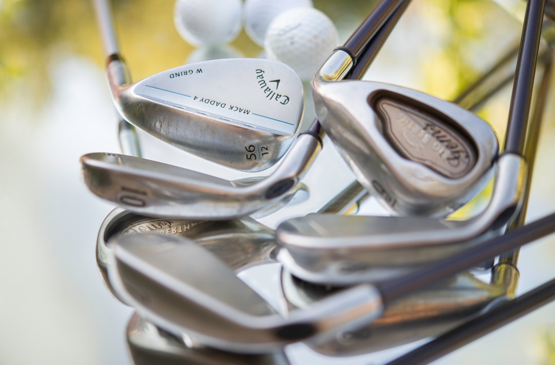 Stack of golf clubs with golf balls