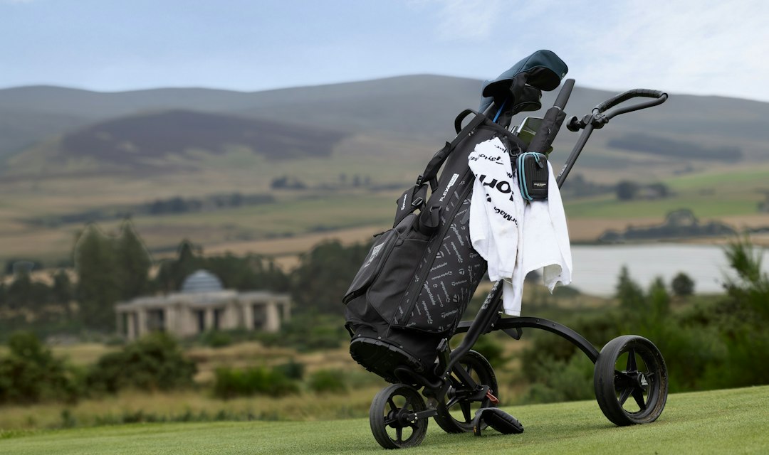 Golf bag on cart with a scenic background