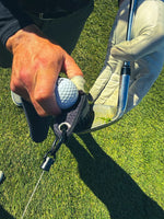 Black Duo Pro brush cleaning grass and dirt from golf club grooves