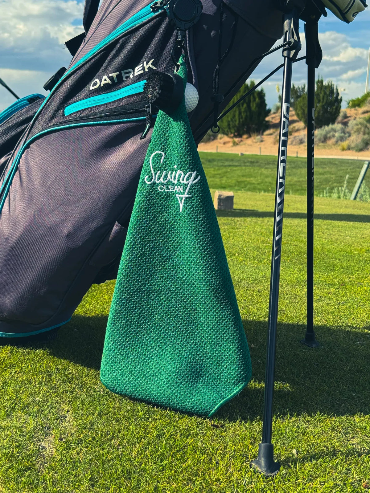 Bentgrass Green Swing Clean Duo Pro waffle towel hanging from a golf stand bag